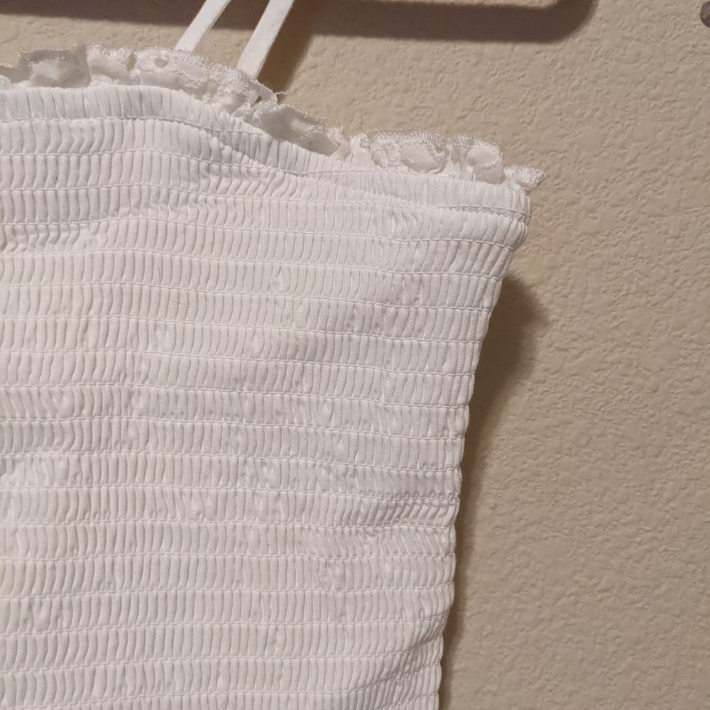 Girls youth large white tank top. Never worn. Adjustable straps.